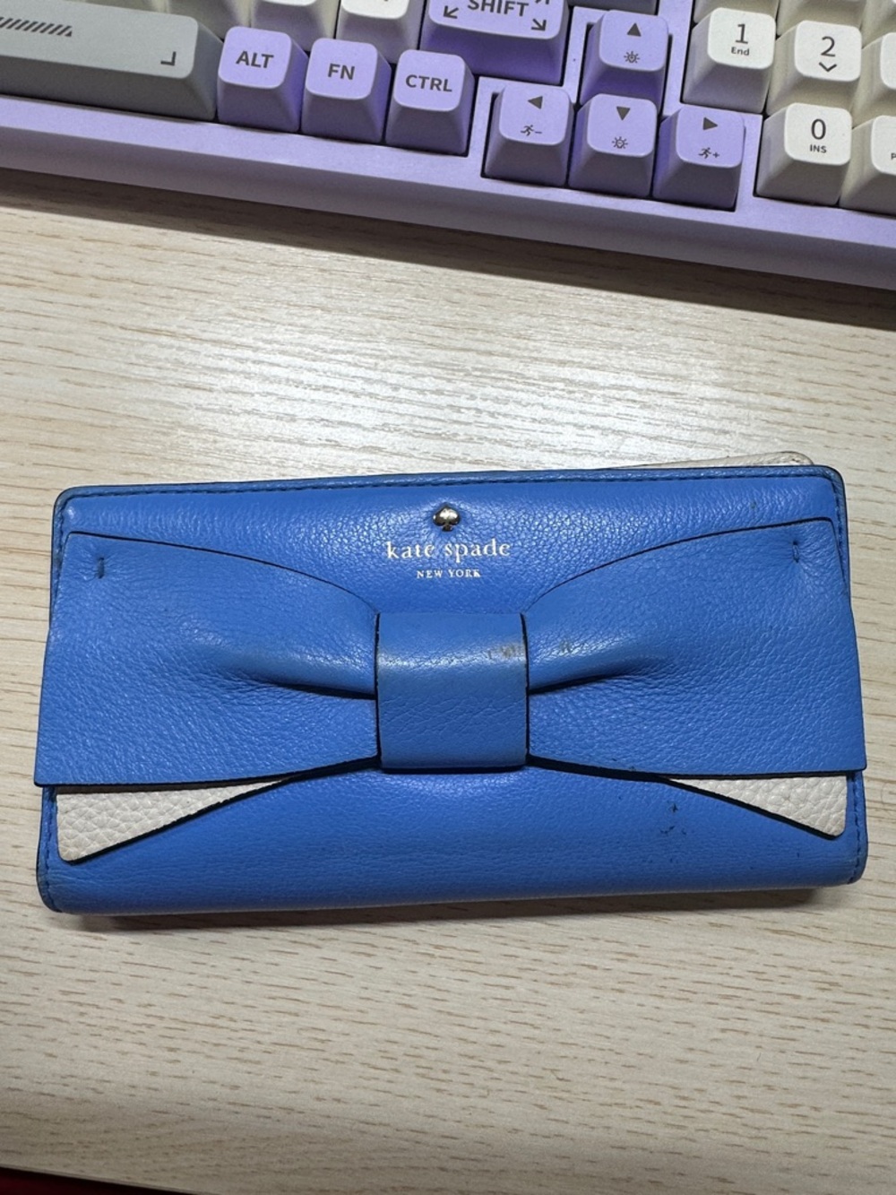 kate spade blue leather bow continental wallet with cream accent
